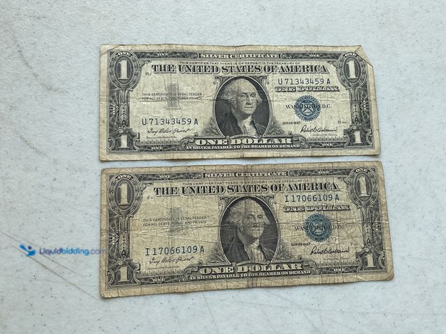 Lot 49-1804344 - LOT OF 2 1957 BLUE SEAL UNITED STATES ONE DOLLAR SILVER CERTIFICATES.