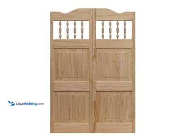 Lot 49-5461476 - Pinecroft 36 in. x 42 in. Royal Orleans Spindle-Top Wood Saloon Door. Model # 843642. Unused