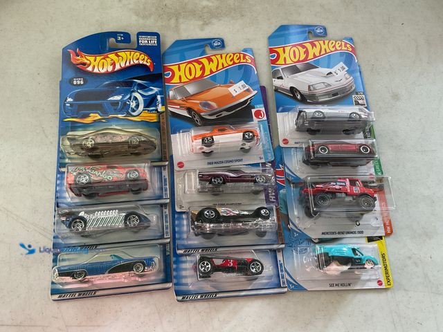 Lot 49-3503550 - Other LOT OF 12 1/64 SCALE DIECAST CARS IN ORIGINAL PACKAGES VARIOUS MAKES AND MODELS