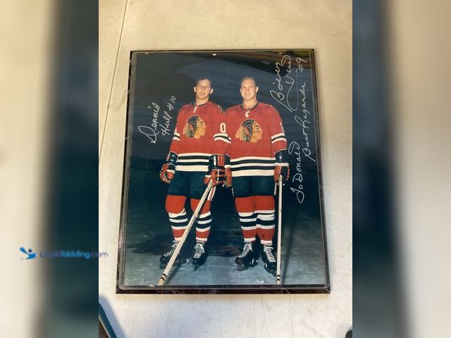 Lot 49-1505190 - COLLECTIBLE VERY NICE CHICAGO BLACKHAWKS LEGENDS AND BROTHERS BOBBY HULL AND DENNIS HULL AUTOGRAPHED...