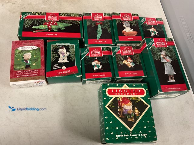Lot 49-1810318 - COLLECTIBLE 10 VINTAGE HALLMARK KEEPSAKE ORNAMENTS IN ORIGINAL BOXES