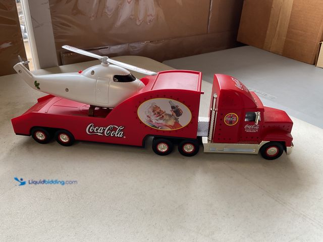Lot 49-5350271 - 2000 COCA-COLA SANTA PACK SEMI TRUCK AND TRAILER WITH HELICOPTER NO ORIGINAL BOX