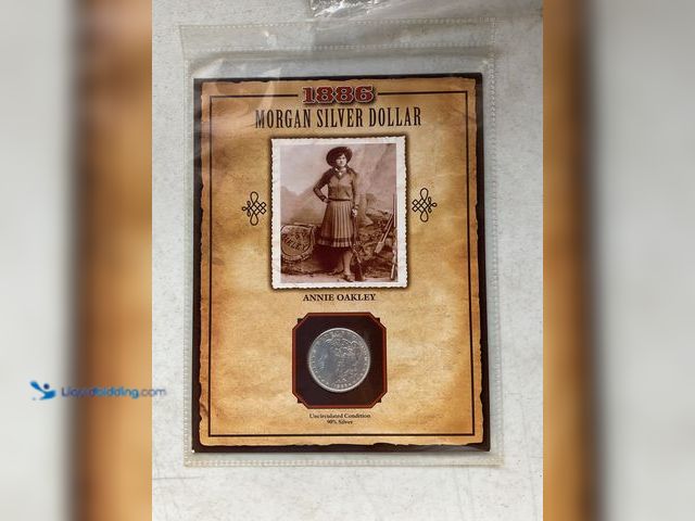 Lot 49-1830608 - 1880 MORGAN SILVER DOLLAR “ANNIE OAKLEY” UNCIRCULATED CONDITION 90% SILVER #COINS0219