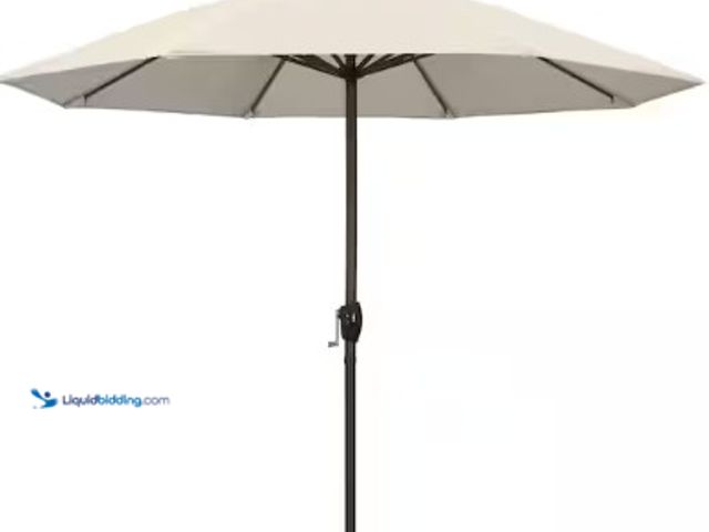 Lot 49-2025323 - California Umbrella 9 ft. Aluminum Auto Tilt Patio Umbrella in Antique Beige Olefin, Model # ATA9081...