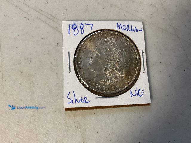 Lot 49-1811317 - 1887 MORGAN SILVER ONE DOLLAR COIN 90% SILVER