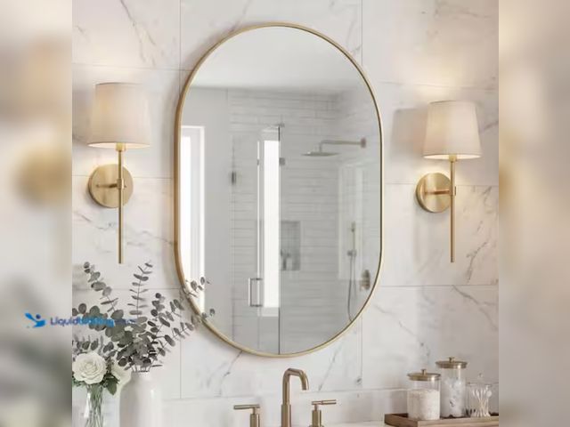 Lot 49-2000483 - JONATHAN Y Milly 24 in. W x 36 in. H Medium Oval Metal Framed Wall Mirror, Gold, Model # MIR202C, Un...