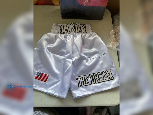 Lot 49-1830557 - COLLECTIBLE PRO BOXER AND CHAMP DEVIN HANEY AUTOGRAPHED SHORTS WITH BECKETT WITNESS HOLO STICKER COA...