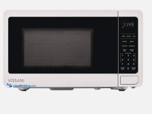 Lot 49-5555496 - Vissani 0.7 cu. ft 700-Watt Countertop Microwave Oven in White, Unused with attachments, works