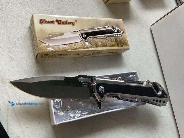 Lot 49-1830628 - COLLECTIBLE FROST CUTLERY 4.75 INCH ASSISTED OPENING STAINLESS STEEL BLADE PAKKAWOOD INLAY IN ORIGIN...