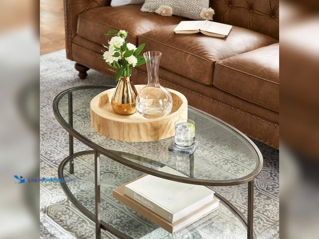 Lot 49-5508260 - Home Decorators Collection
Bella Large Oval Antique Bronze Metal and Glass Coffee Table with Shelf ...