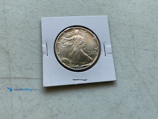 Lot 49-1804206 - 1990 WALKING LIBERTY SILVER EAGLE COIN.