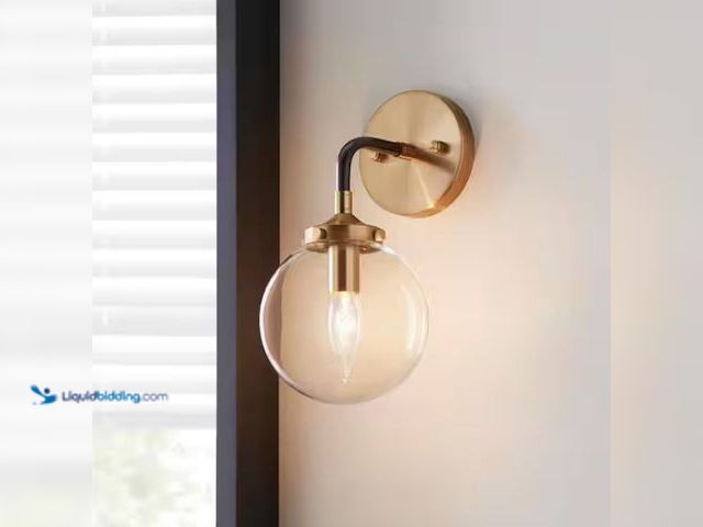 Lot 49-2000863 - Home Decorators Collection 1-Light Matte Black and Antique Gold Wall Sconce, Model # TNP1475, Unused...