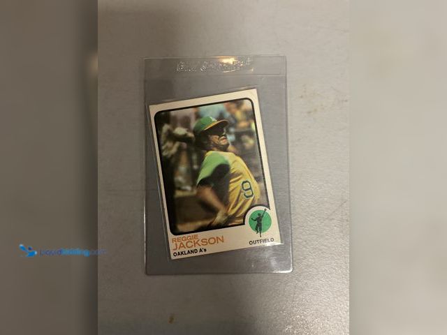 Lot 49-1830568 - COLLECTIBLE AMAZING 1973 TOPPS REGGIE JACKSON BASEBALL OAKLAND A’S #255 AMAZING CARD FOR ANY COLLECT...