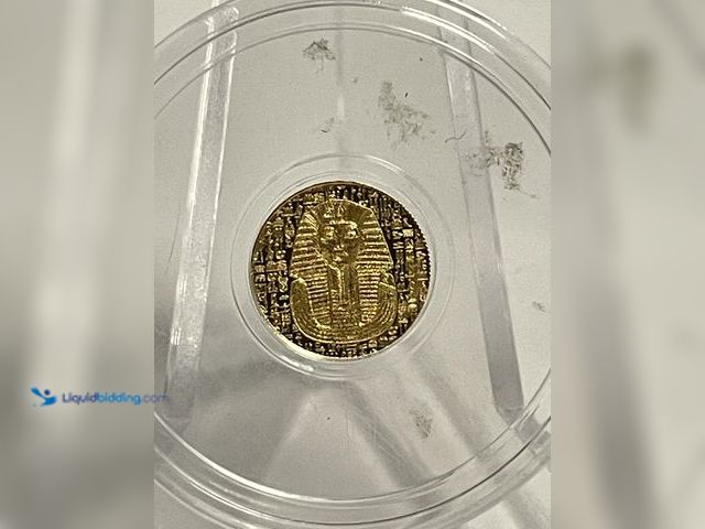Lot 49-910583 - Beautiful Egyptian-themed commemorative coin containing 1/200 troy ounce of real gold. The obverse f...