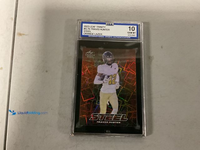 Lot 49-1505968 - WOW GRADED CARD 2023 LEAF TRINITY TRAVIS HUNTER ROOKIE STEEL ORANGE LAZER /15 #S-75 ISA 10 GEM MINT ...
