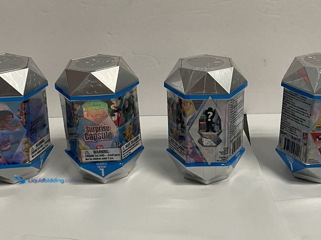 Lot 49-910392 - Disney 100 Surprise Capsule – Series 1 Mystery Collectible (Lot of 4). Celebrate 100 years of Disney...