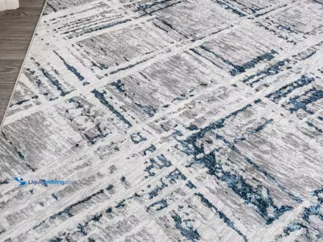 Lot 49-2026111 - JONATHAN Y Slant Modern Abstract Gray/Blue 8 ft. x 10 ft. Area Rug, Model # SOR201B-8. MSRP: $167.14...