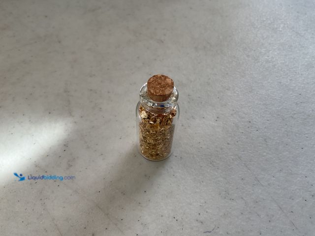 Lot 49-5450043 - RARE ONE INCH GLASS VILE OF PURE 24K GOLD FLAKES