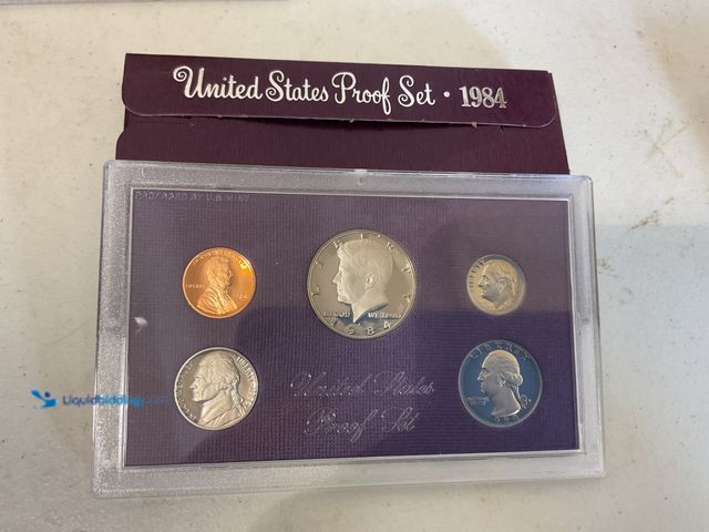Lot 49-5515674 - 1984 UNITED STATES PROOF SET 5 COINS IN HARD PLASTIC CASE WITH ORIGINAL SLEEVE