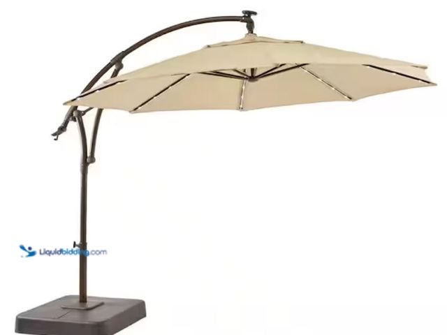 Lot 49-2005992 - Hampton Bay 11 ft. Cantilever Aluminum and Steel Solar LED Offset Outdoor Patio Umbrella in Putty Be...