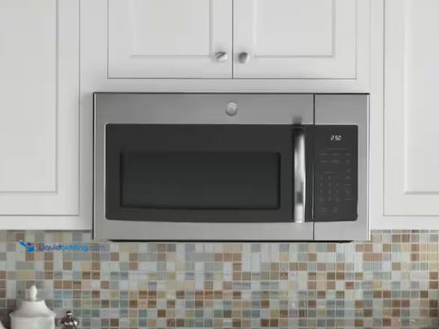 Lot 49-1549410 - GE 1.6 cu. ft. Over-the-Range Microwave in Stainless Steel, Model # JVM3160RFSS, Unused, Back and bo...