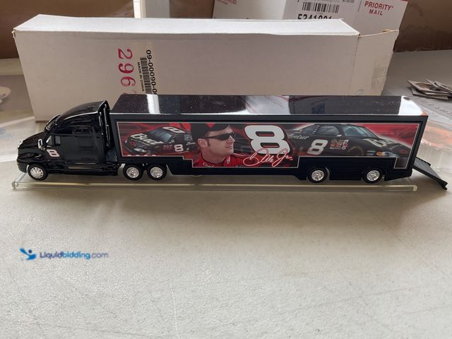 Lot 49-5341813 - NICE 1/64 SCALE DIECAST SEMI TRUCK AND TRAILER DALE EARNHARDT JR #8 BUD IN ORIGINAL BOX