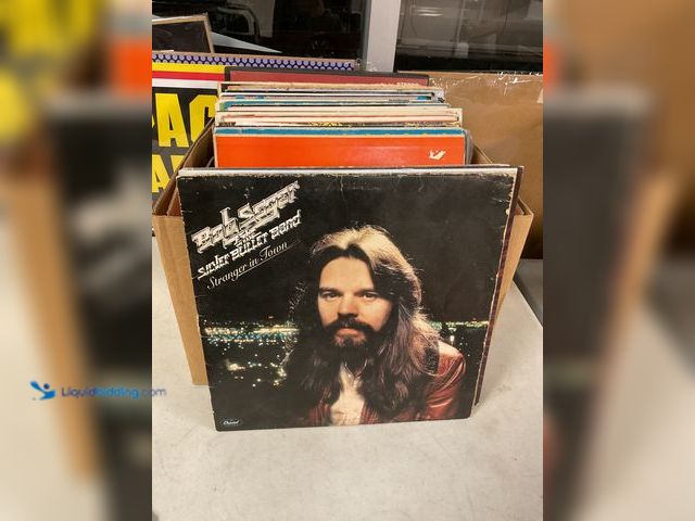 Lot 49-1505460 - COLLECTIBLE LARGE BOX FULL OF PRE-OWNED VINYL RECORDS FROM VARIOUS YEARS AND GENRES INCLUDING BOB SE...