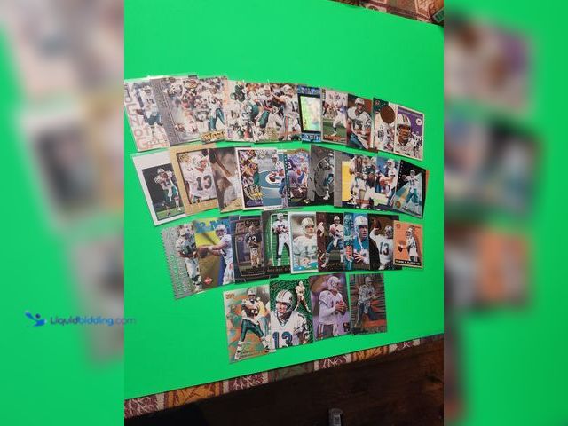 Lot 49-1913940 - 35- COLLECTIBLE DAN MARINO NFL FOOTBALL CARDS. VARIOUS BRANDS AND YEARS PRODUCED. ALL CARDS ARE IN P...
