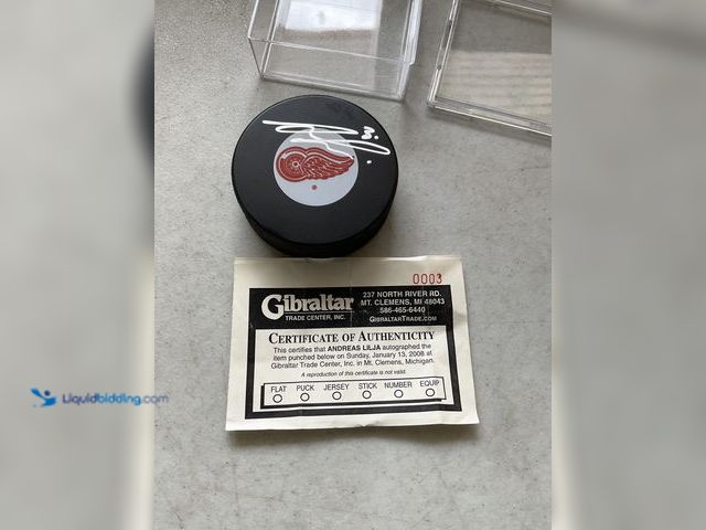 Lot 49-5515566 - Other VERY NICE DETROIT RED WINGS LEGEND ANDREAS LILJA AUTOGRAPHED HOCKEY PUCK WITH COA
