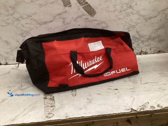 Lot 49-5573413 - Milwaukee 6-1/2'' Circular Saw, Unused with attachments and bag only, works, damaged bag
