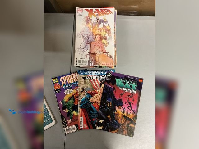Lot 49-1830571 - COLLECTIBLE LOT OF 20 COLLECTIBLE COMIC BOOKS FROM DC, MARVEL AND MORE. INCLUDING JUSTICE LEUGUE, SP...