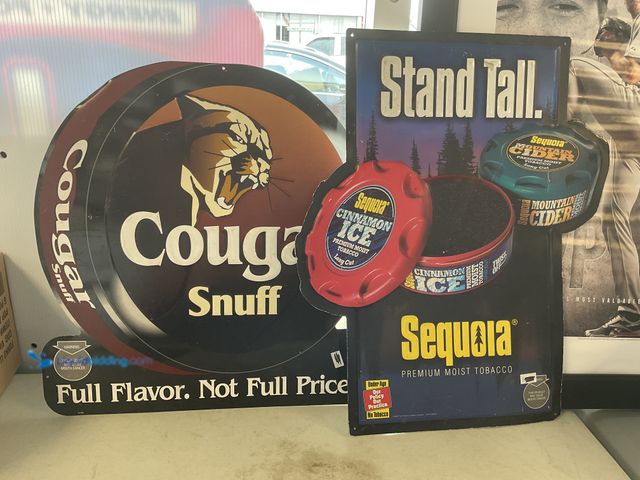 Lot 49-5350249 - LOT OF 2 PRE-OWNED METAL COLLECTOR SIGNS INCLUDING COUGAR SNUFF AND SEQUOIA CINNAMON ICE. EAC SIGN M...