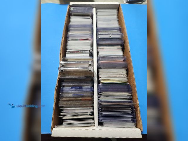 Lot 49-1817848 - COLLECTION OF SPORTS CARDS. VARIOUS SPORTS BRANDS AND YEARS PRODUCED. MANY ARE IN PROTECTIVE CASES. ...