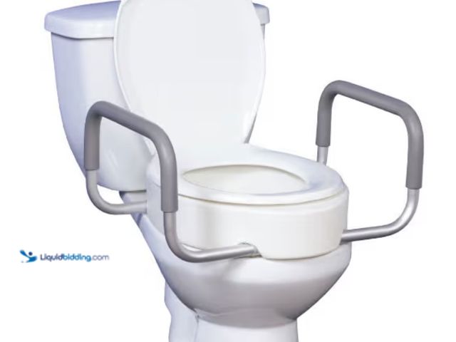 Lot 49-3566048 - Premium Raised Standard Toilet Seat with Removable Arms, 17" Depth. SKU:
DR12402. Unused with attac...