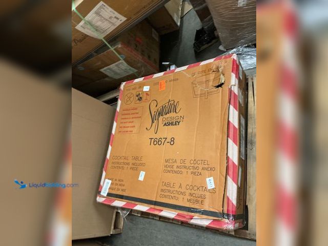 Lot 49-5463489 - Signature DESIGN BY ASHLEY
Tanidore 36 in. Brown Round Marble Coffee Table. Item is Unused