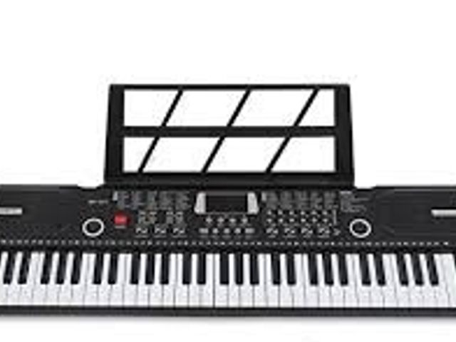 Lot 49-5450042 - 61 Key Electronic Keyboard. Used