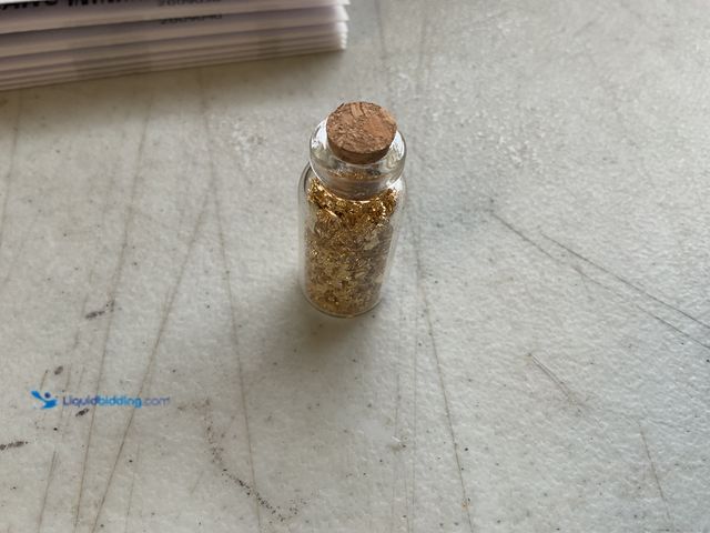 Lot 49-2009036 - RARE ONE INCH GLASS VILE OF PURE 24K GOLD FLAKES