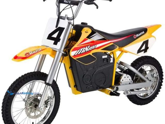 Lot 49-3536802 - Razor MX650 Dirt Rocket Electric Motocross Off-Road Bike - Yellow. Model #B000FK7C60. Used with atta...