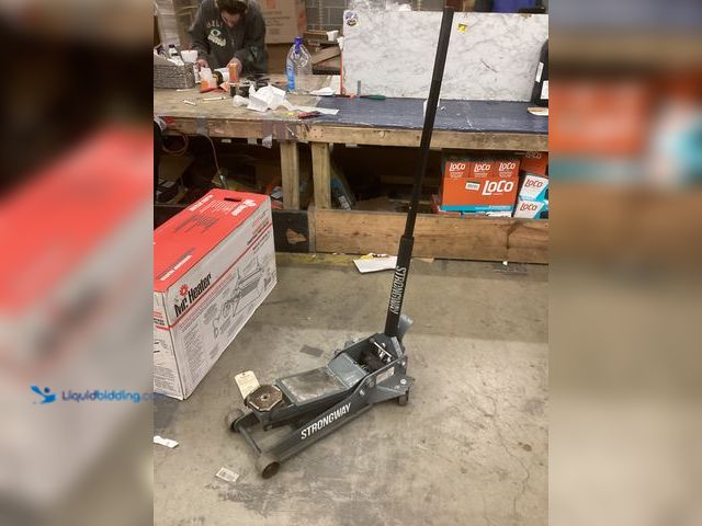 Lot 49-3539702 - Strongway Floor Jack With Handle (Gray) Item is used, has compression, missing screw