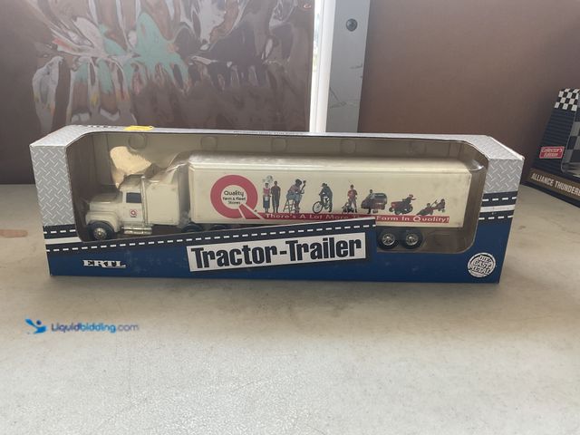 Lot 49-3609276 - Other ERTL TRACTOR-TRAILER QUALITY FARM AND FLEET STORES 1/64 SCALE DIECAST TRANSPORTER NEW IN BOX