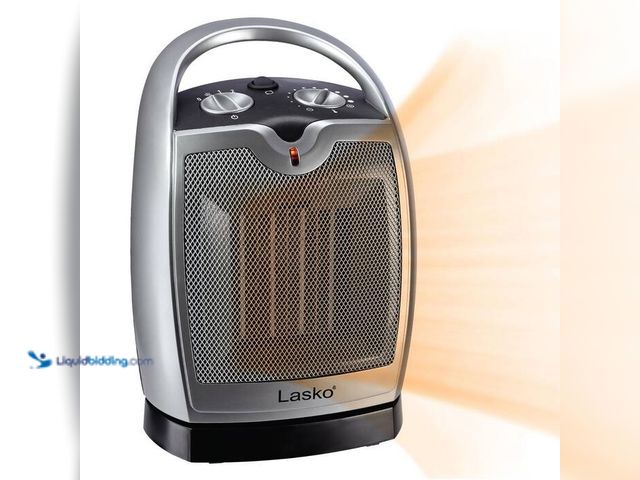 Lot 49-1515960 - Lasko Compact 11.25 in. 1500-Watt Electric Ceramic Portable Oscillating Space Heater. Model# 5409. U...