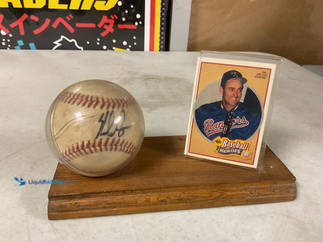 Lot 49-1505454 - COLLECTIBLE VERY NICE DISPLAY WITH WOOD STAND WITH NOLAN RYAN AUTOGRAPHED BASEBALL AND CARD. THIS IS...