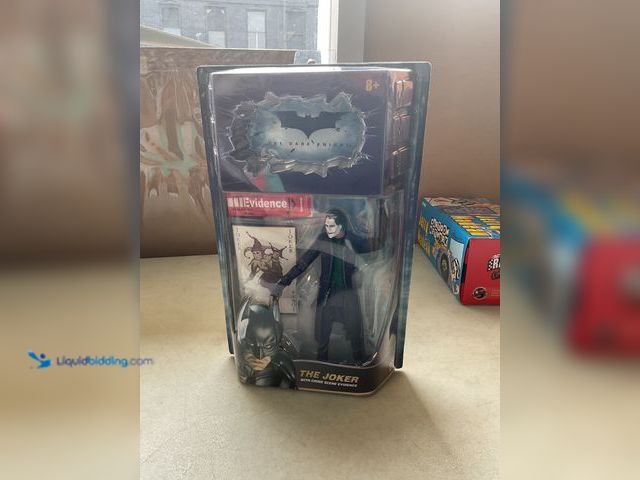 Lot 49-3609270 - Other NEW BATMAN THE DARK KNIGHT “THE JOKER” WITH CRIME SCENE EVIDENCE ACTION FIGURE SEALED IN BOX