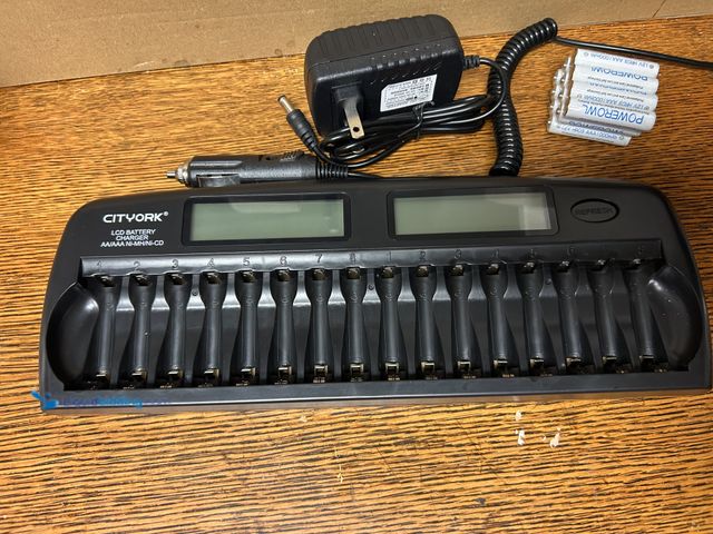 Lot 49-1814169 - New 16 capacity battery charger Electric 16 capacity battery charger comes with 32 AAA rechargeable ...