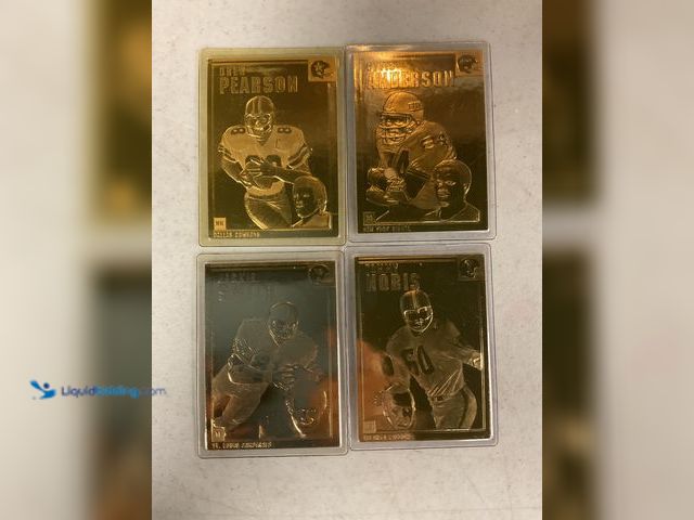 Lot 49-1505447 - COLLECTIBLE LOT OF 4 FOOTBALL 22K GOLD FOIL SPORT CARDS ALL SEALED INCLUDING GREAT NAMES LIKE JACKIE...