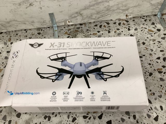 Lot 49-5446954 - SKY RIDER Pro Quadcopter Drone with Wi-Fi Camera, Remote and Phone Holder, White Unused, unable to t...