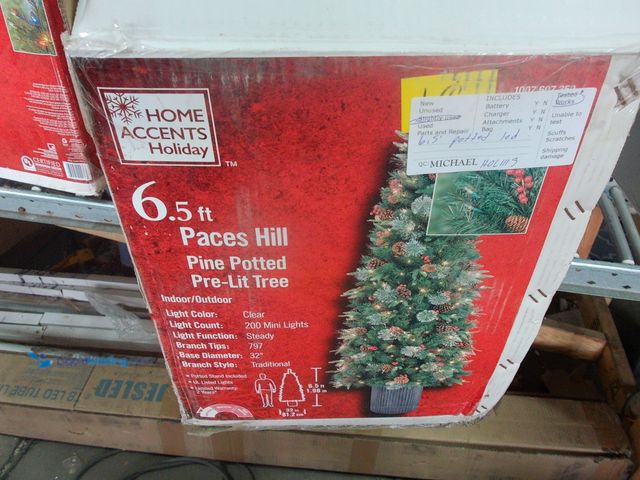 Lot 49-1544872 - Home Accents Holiday 6.5 ft Paces Hill Pine Potted Pre-Lit Tree, Model # 1007607350, Slightly used, ...