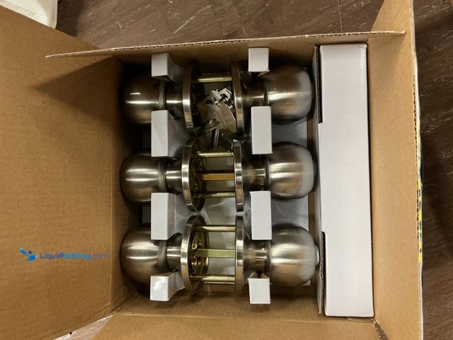 Lot 49-3528553 - Entry Door Knob with Keyed Lock (satin nickel) (attachments included) Unused