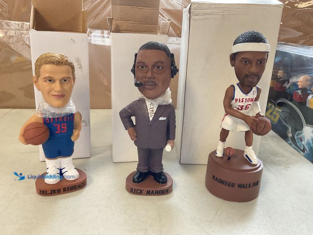 Lot 49-1811343 - COLLECTIBLE 3 DETROIT PISTONS COLLECTIBLE BOBBLE HEADS  INCLUDING ZELJKO REBRACA, RICK MAHORN AND RA...