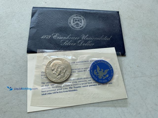 Lot 49-1804208 - 1973 EISENHOWER UNCIRCULATED SILVER DOLLAR.